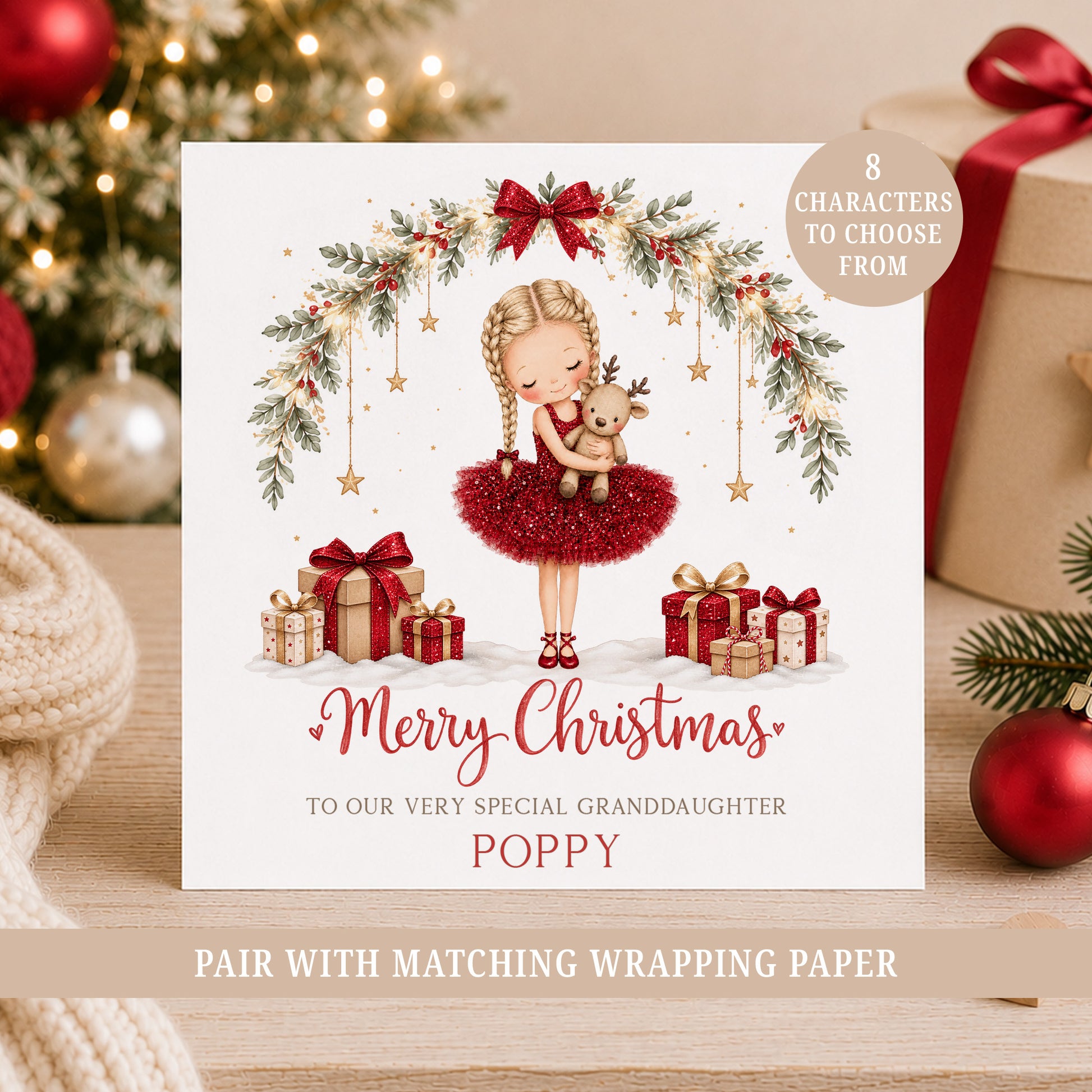 Personalised girls Christmas card featuring a little ballerina in a red printed glitter-effect dress holding a reindeer, with festive greenery, bows and gifts.