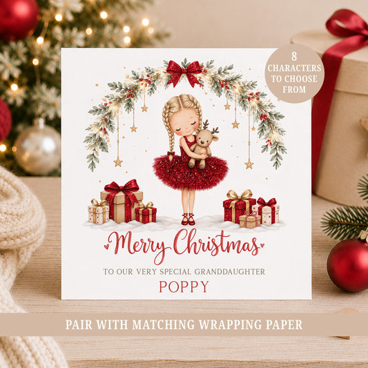 Personalised girls Christmas card featuring a little ballerina in a red printed glitter-effect dress holding a reindeer, with festive greenery, bows and gifts.