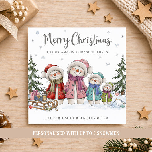 Personalised Grandchildren Christmas card featuring a colourful snowman family in a snowy Christmas scene with  trees, presents and a sledge, personalised with up to 5 snowmen and each grandchild’s name.