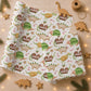 Personalised Christmas wrapping paper with festive dinosaurs, Christmas pudding dinosaurs, candy canes and the child’s name.
