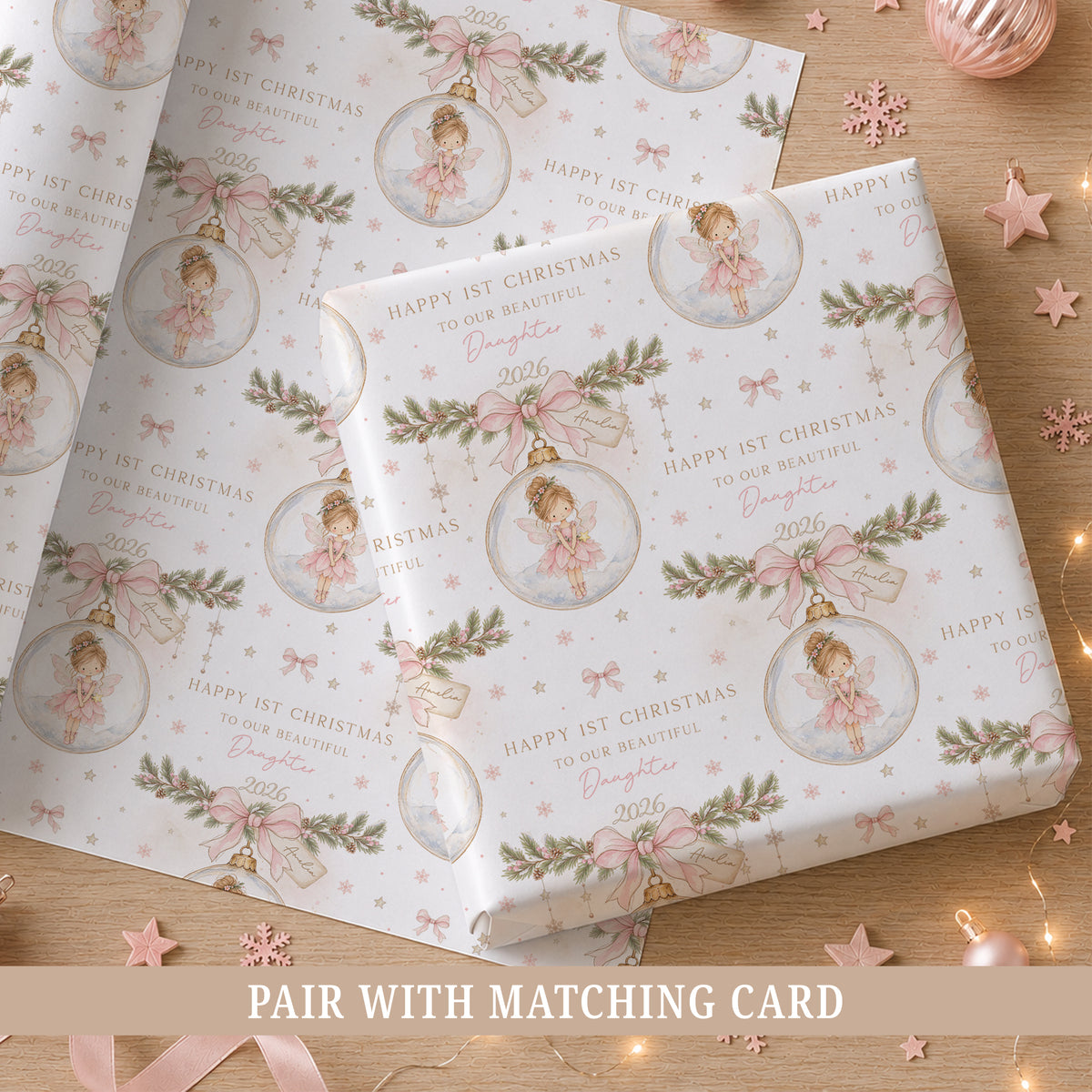 Personalised First Christmas wrapping paper for Daughter featuring a pink fairy, Christmas greenery, bows and snowflakes.