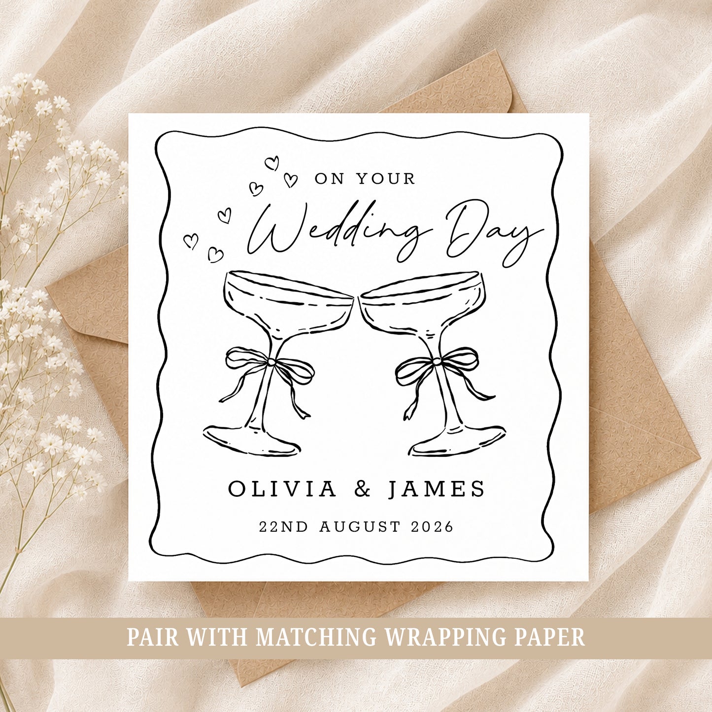 Personalised wedding card featuring two champagne glasses with names and wedding date