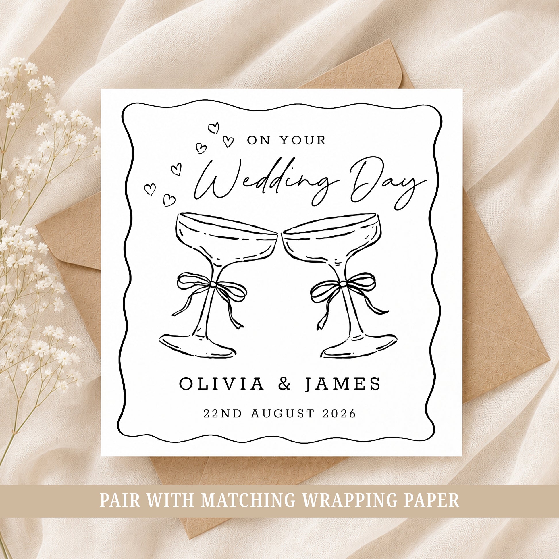 Personalised wedding card featuring two champagne glasses with names and wedding date