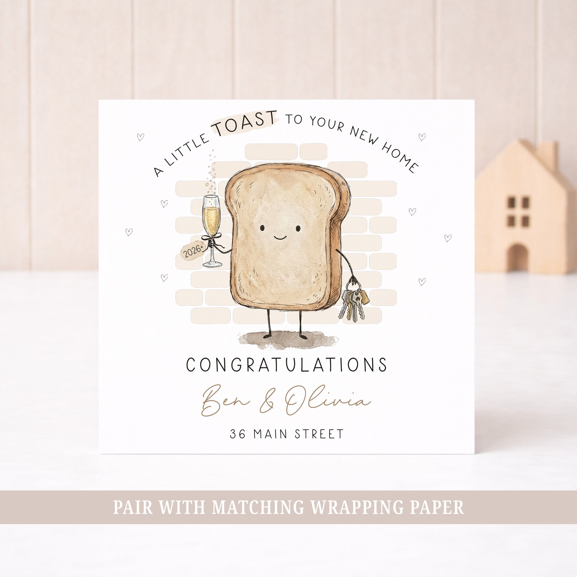 Personalised new home card featuring a toast character holding house keys and a champagne glass