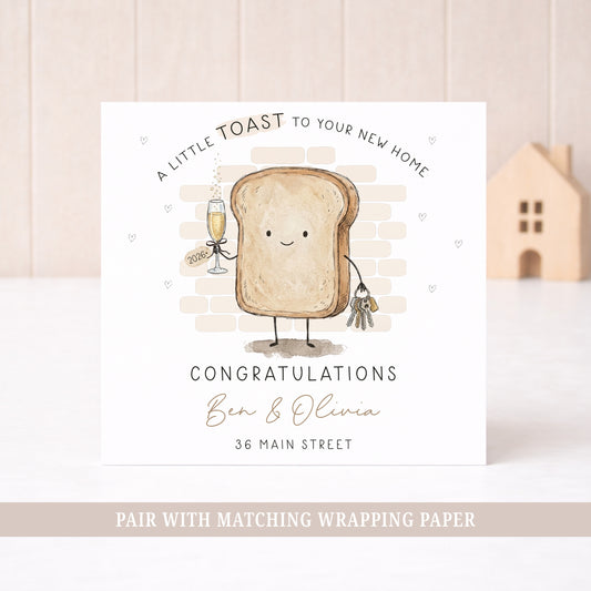 Personalised new home card featuring a toast character holding house keys and a champagne glass