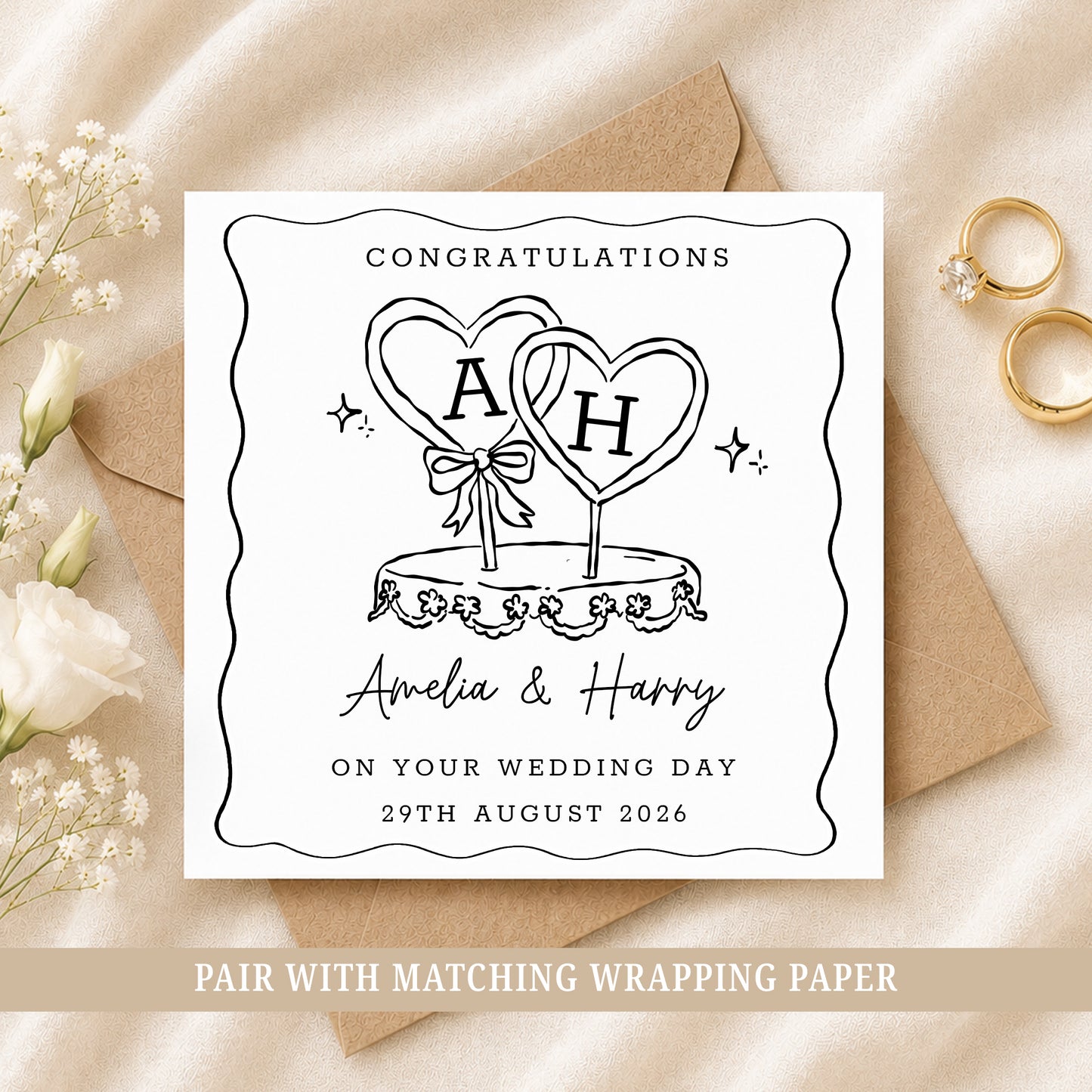 Personalised wedding card featuring a black and white wedding cake with heart toppers, customised with the couple's names and wedding date.