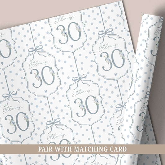 Personalised 30th birthday floral number wrapping paper with blue polka dot background and personalised name.