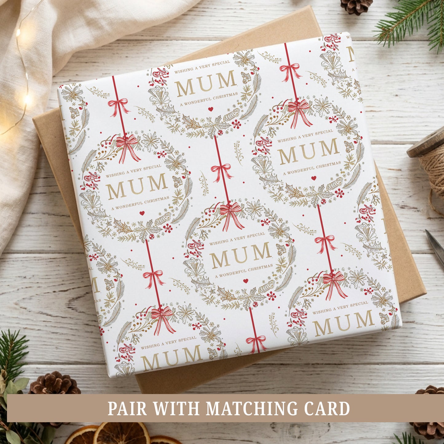Personalised Mum Christmas wrapping paper featuring an elegant red and gold festive wreath design with bows and botanical details.