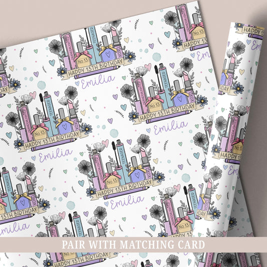 Personalised 13th birthday makeup wrapping paper with illustrated cosmetics, flowers and name.
