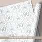 Personalised 90th birthday floral number wrapping paper with blue polka dot background and personalised name.