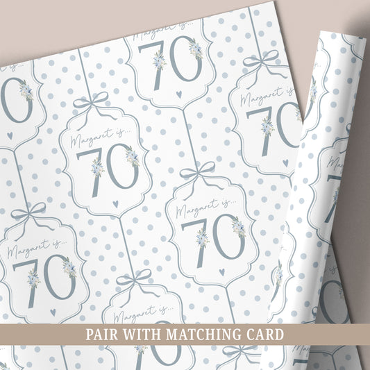 Personalised 70th birthday floral number wrapping paper with blue polka dot background and personalised name