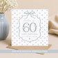 Personalised 60th birthday floral number card with blue polka dot background, name and optional relation.
