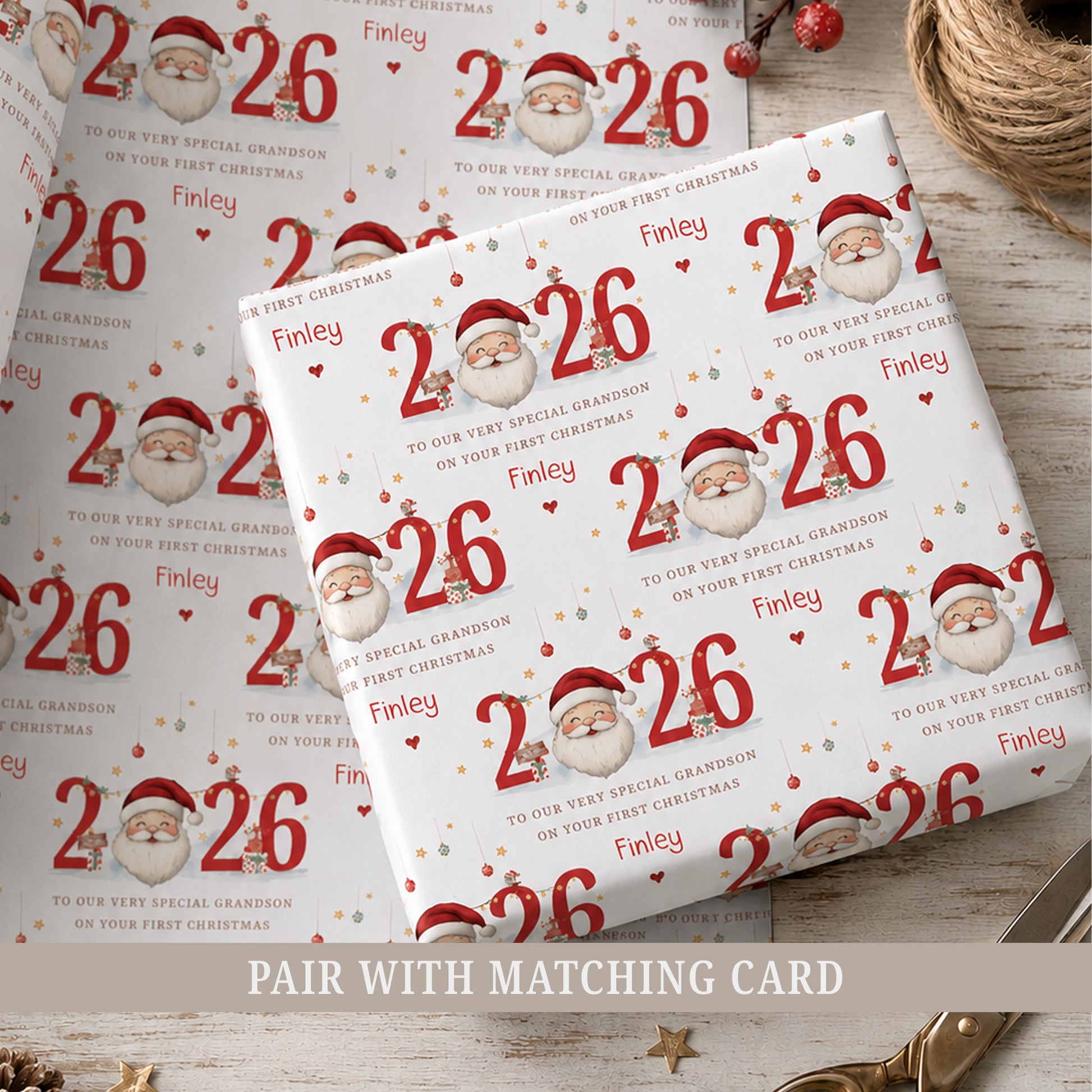 Personalised Nephew First Christmas wrapping paper featuring Santa, red 2026 numbers and the child's name and relation.