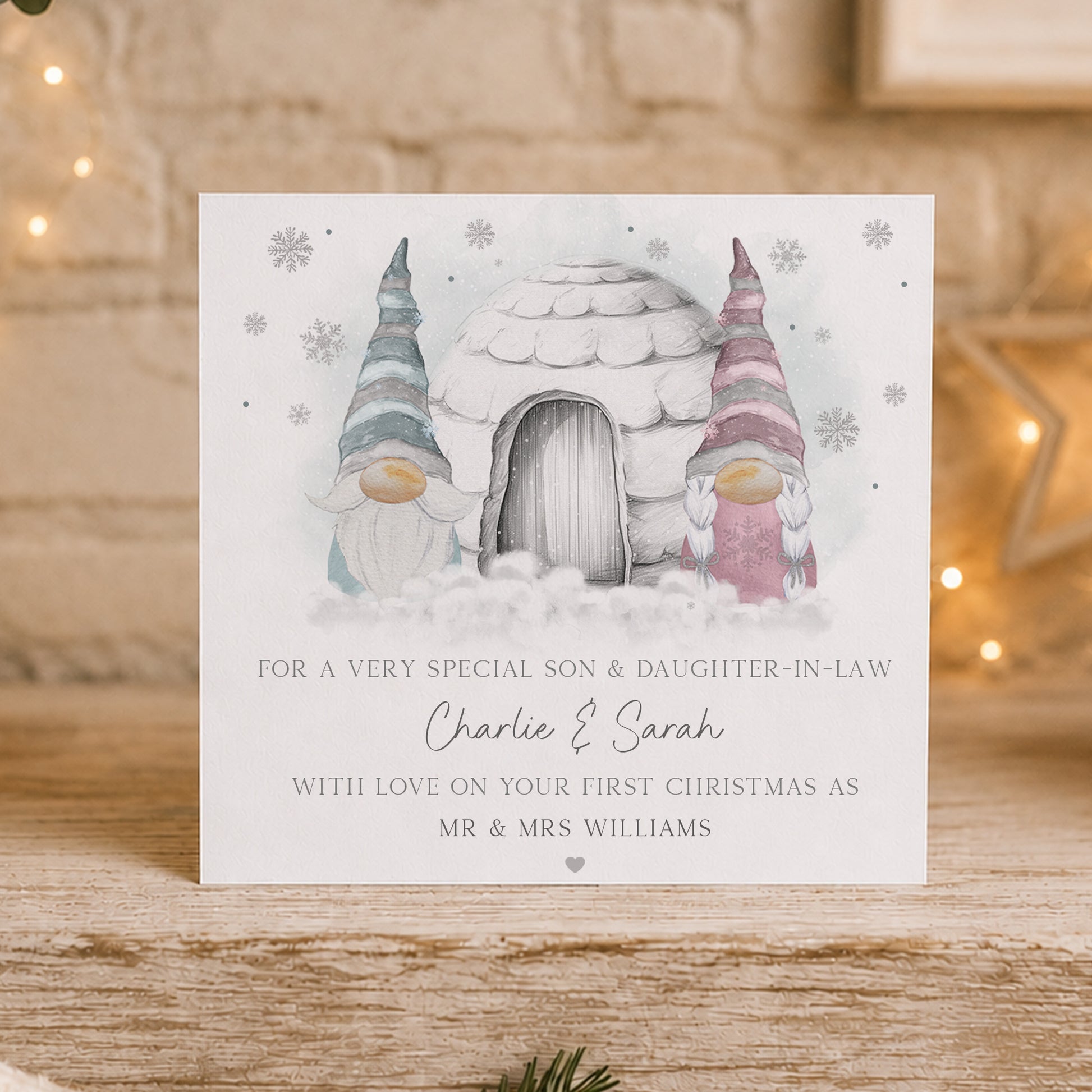Personalised First Christmas married card featuring a festive gnome couple beside a snowy igloo, personalised with the couple’s names, surname and relation.