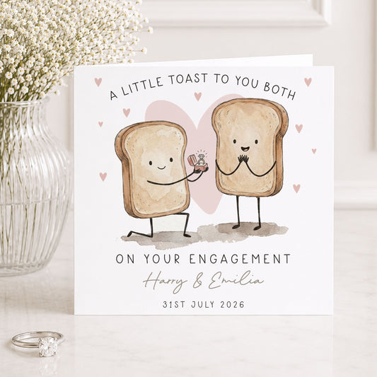 Personalised engagement card featuring two toast characters and an engagement ring proposal