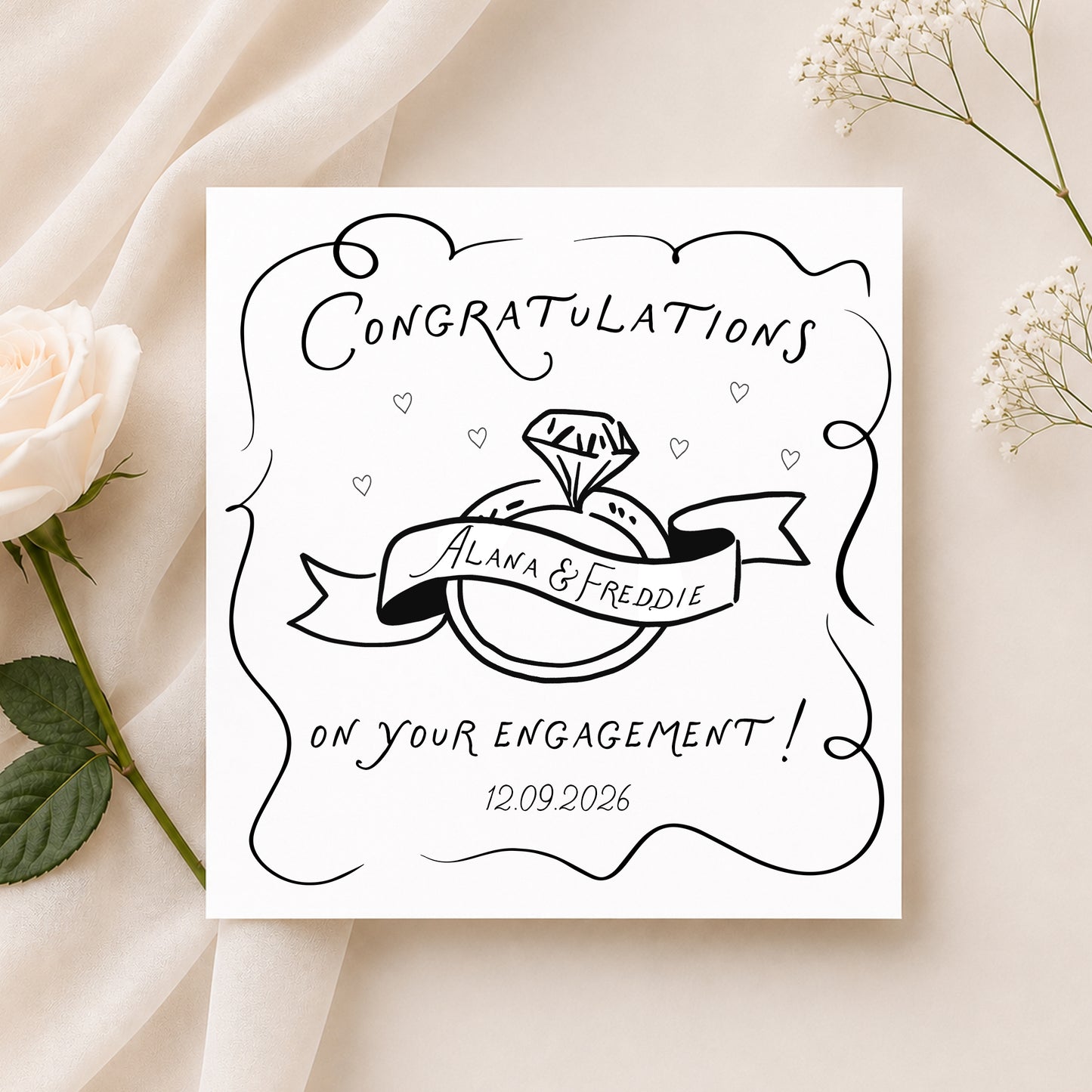 Personalised engagement card featuring a black and white ring illustration, customised with the couple's names and engagement date.