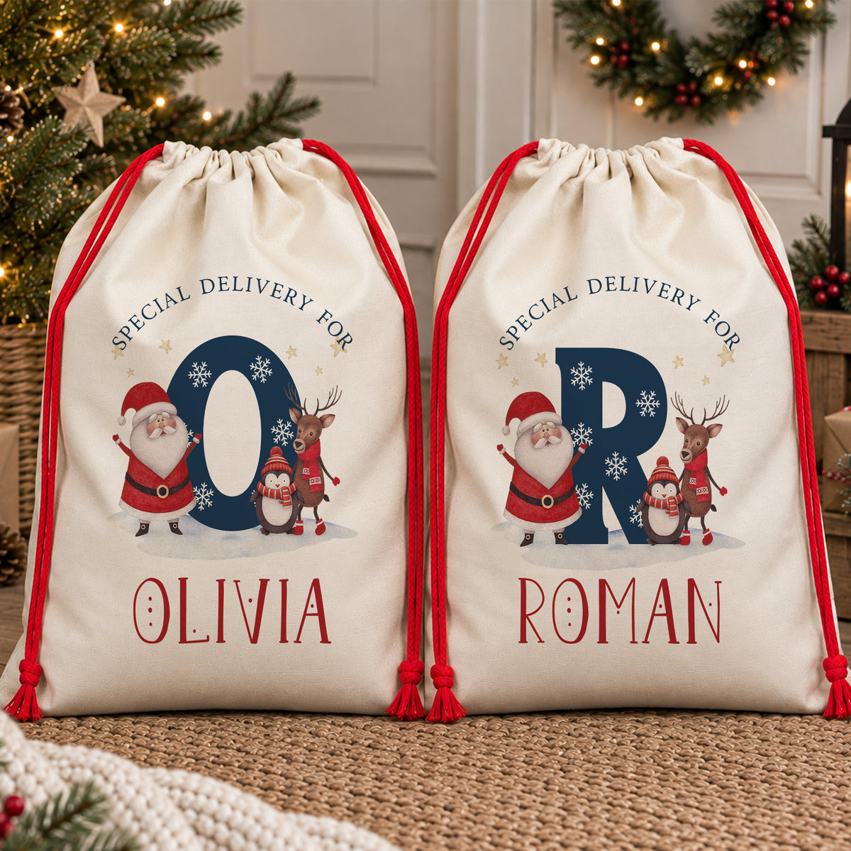 Personalised kids Christmas sack featuring a large navy initial decorated with snowflakes alongside Santa, a reindeer and penguin, with “Special Delivery For” above and the child's chosen name printed underneath. Natural poly linen Santa sack with a red drawstring, available in two sizes.