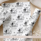 Personalised wedding wrapping paper featuring a black and white bride and groom bicycle design, customised with the couple's names and wedding date.