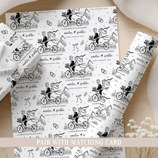 Personalised wedding wrapping paper featuring a black and white bride and groom bicycle design, customised with the couple's names and wedding date.