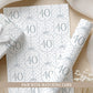 Personalised 40th birthday floral number wrapping paper with blue polka dot background and personalised name.