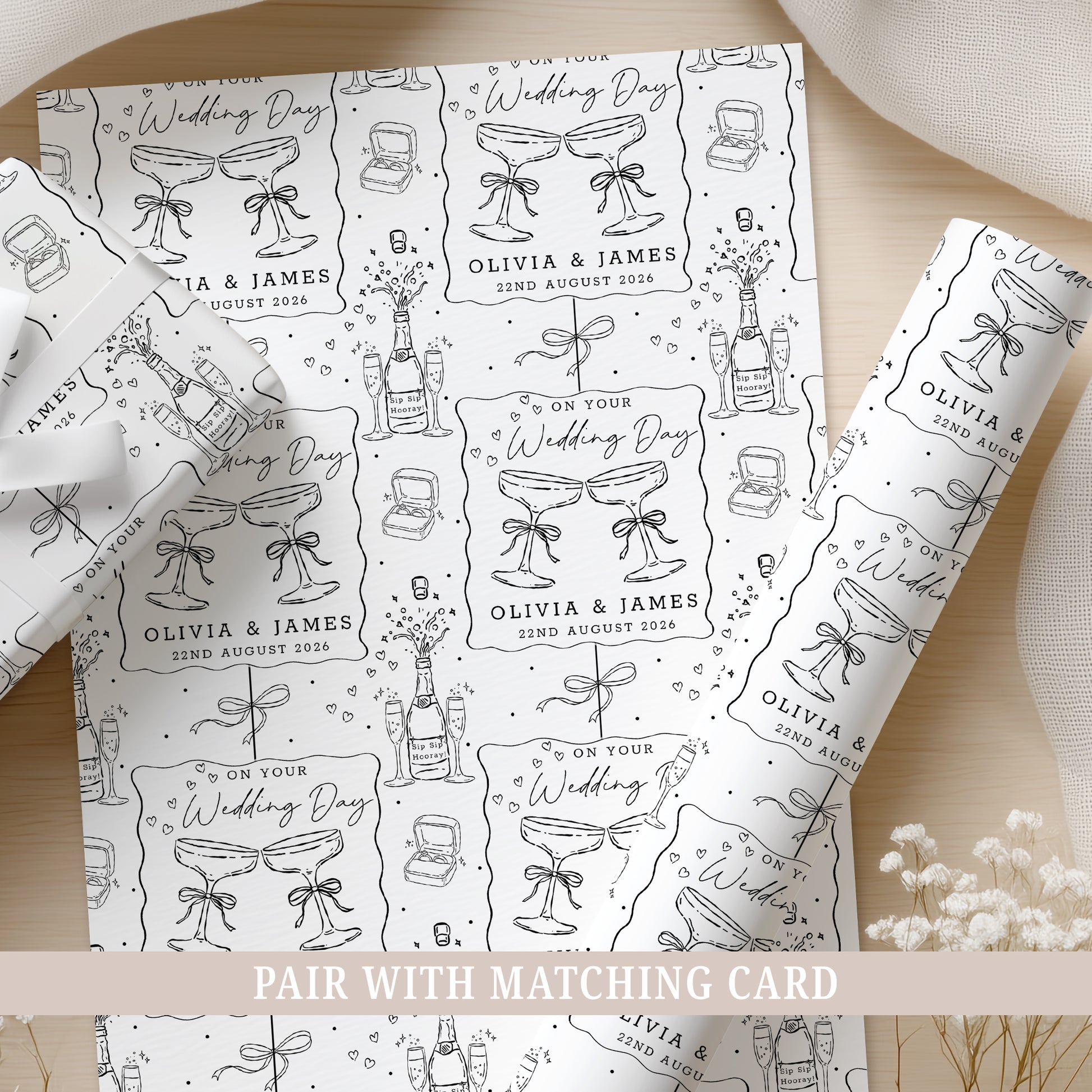 Personalised wedding wrapping paper featuring champagne glasses, names and wedding date