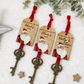 Personalised Santa's Magic Key with antique-style key, red ribbon and wooden Santa name tag for Christmas Eve.