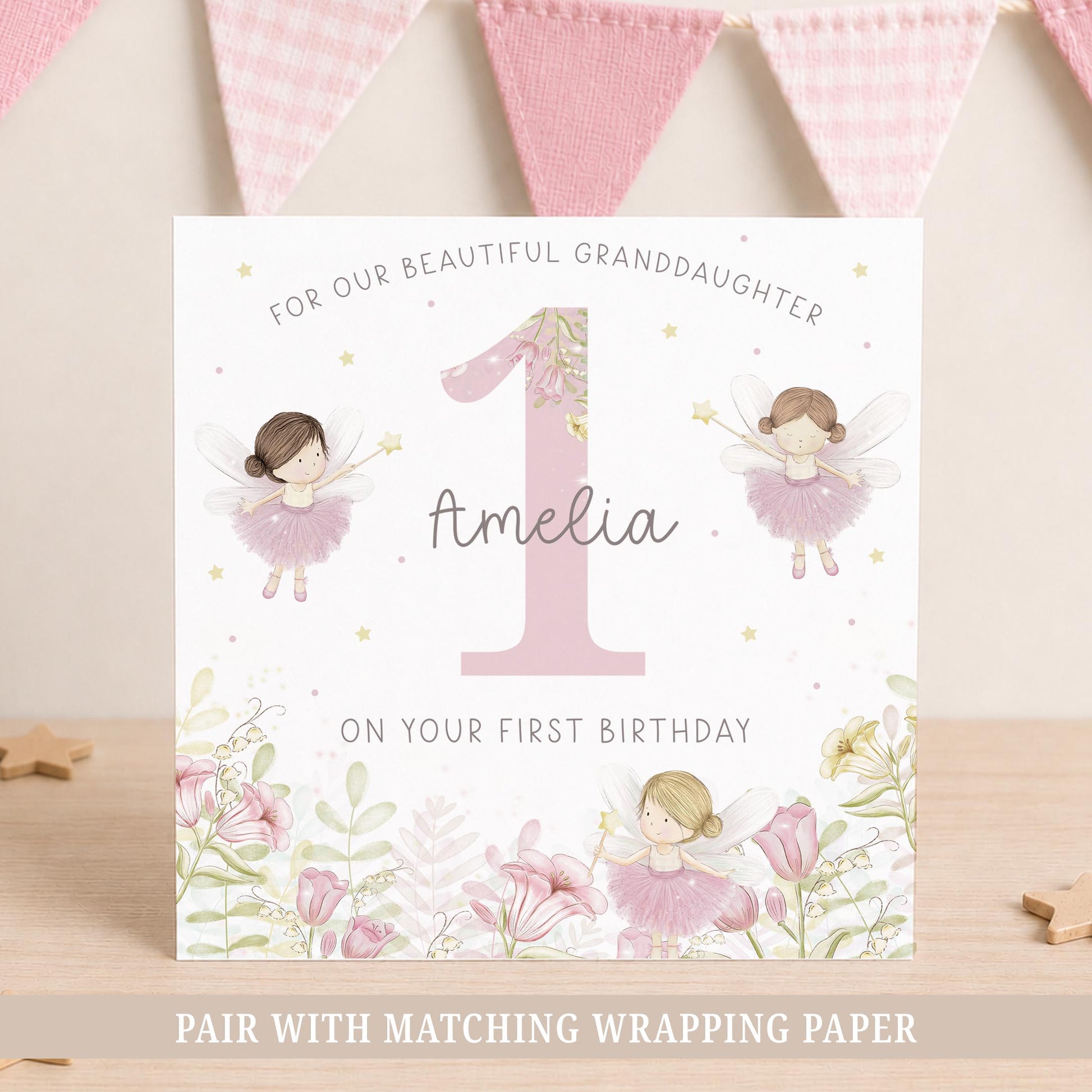 Personalised first birthday card for daughter featuring fairy illustrations, pink flowers and custom name detail.