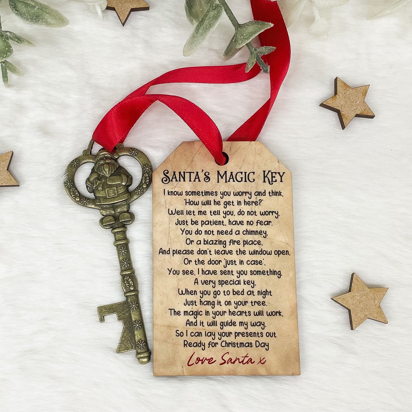 Reverse of personalised Santa's Magic Key wooden tag showing Christmas Eve poem with antique-style key and red ribbon.