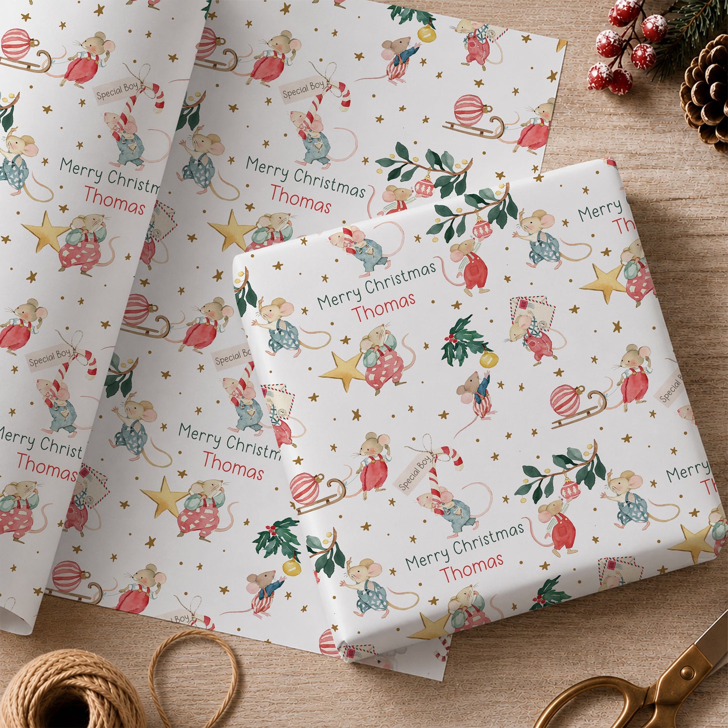 Personalised Christmas wrapping paper featuring illustrated festive mice with baubles, candy canes, holly and stars, personalised with name and relation.