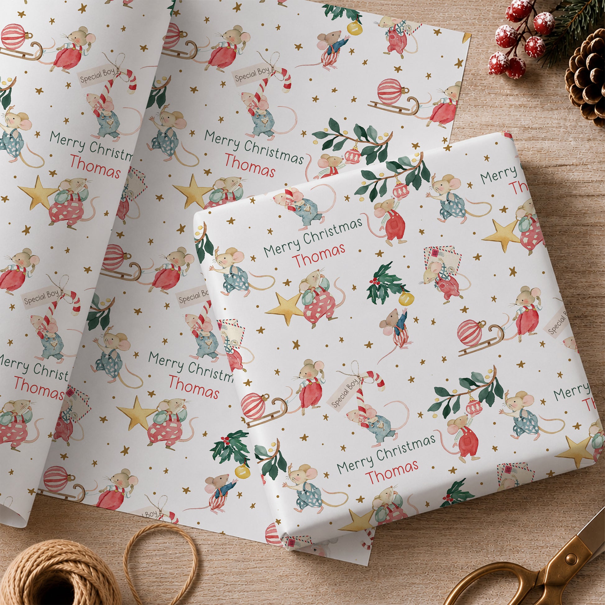 Personalised Christmas wrapping paper featuring illustrated festive mice with baubles, candy canes, holly and stars, personalised with name and relation.