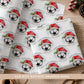 Personalised football Christmas wrapping paper for boys featuring a football wearing a red Santa hat, holly, snow and the child’s name.