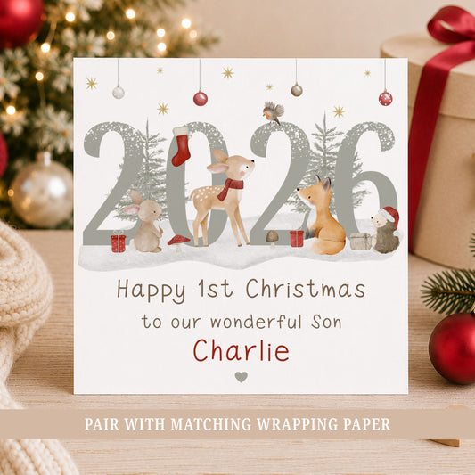 Personalised Son First Christmas card featuring woodland animals, 2026 design and the child’s name, with deer, bunny, fox and hedgehog illustrations.