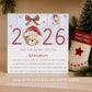 Personalised Godson First Christmas card featuring a festive teddy bear in a Santa hat, 2026 design and the child’s name.