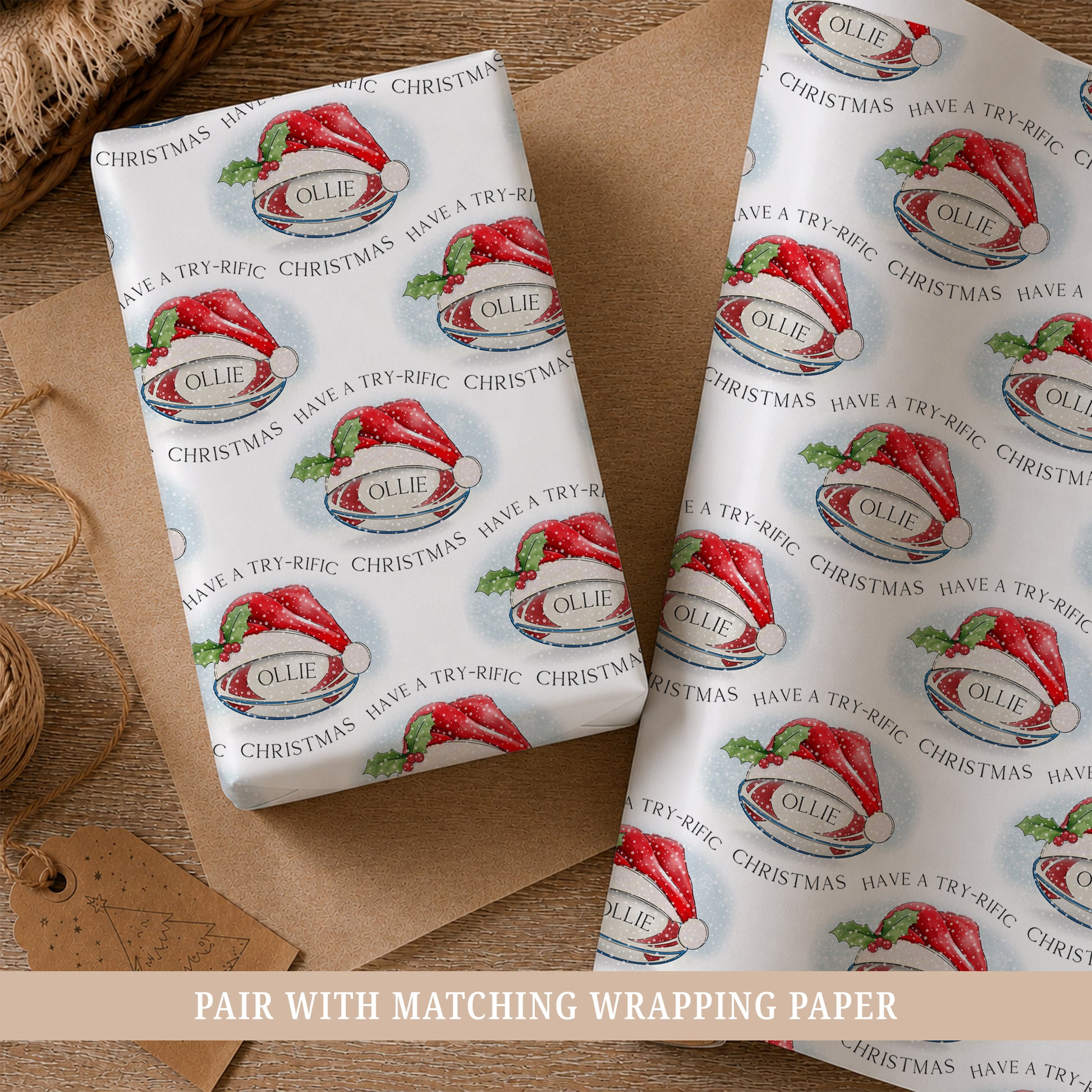 Personalised rugby Christmas wrapping paper for boys featuring a rugby ball wearing a red Santa hat with holly, snow and the child’s name.